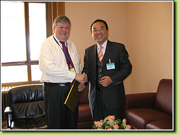 Assistant Commissioner for Labour (Employees' Rights and Benefits), Mr Stanley NG Ka-kwong, meets the Executive Director of the Standards and Fundamental Principles and Rights at Work Sector of the International Labour Office, Mr Kari TAPIOLA (left).  