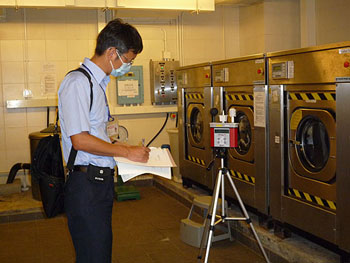 An Occupational Hygienist assessing the risk of heat stress at an indoor workplace.