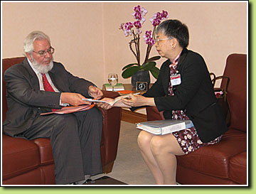 Deputy Commissioner for Labour (Labour Administration), Mrs Jenny CHAN MAK Kit-ling, introduces the youth employment initiatives of the LD to the Director-General of the International Labour Office, Mr Juan SOMAVIA (left).