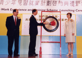 The Financial Secretary,                          Mr Antony Leung (centre); striking                          gong to mark the launching of the Youth Work Experience                          and Training Scheme; With him are the Permanent Secretary for Economic                          Development and Labour (Labour), Mr Matthew Cheung (first from left); and the Commissioner for Labour, Mrs Pamela Tan.