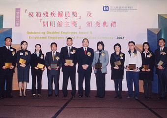 The                                         Secretary for Economic Development and Labour, Mr                                         Stephen Ip (centre) pictured with 10 winners of                                         the Enlightened Employers Award.