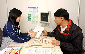 A placement officer rendering employment counselling services to a job-seeker under the Job Matching Programme.