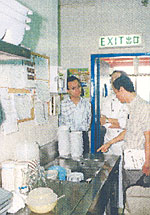 Adjudicators of the Catering Industry Safety Award Scheme assessing the safety and health performance of a participating establishment. 