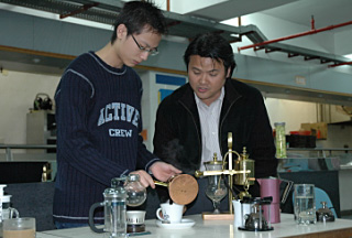 Through job-specific skill training, a YPTP trainee learns about coffee mixing skill to prepare himself for entering the catering industry.