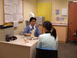 A nurse of the Fanling Occupational Health Clinic providing occupational health counseling to a client.