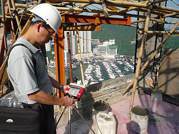 An Occupational Hygienist assessing the risk of heat stress at a construction site